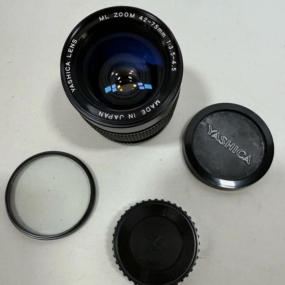 Yashica Zoom Lens 42- 75mm with case & Hakuba uv 55mm lens